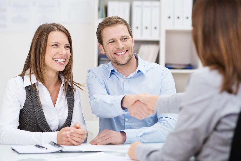 sales meeting where everyone looks happier than they should