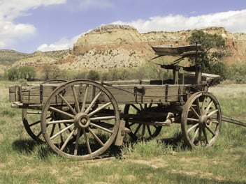 Basic transportation in the Old West wooden wagon on grassy valley floor in New Mexico.jpeg
