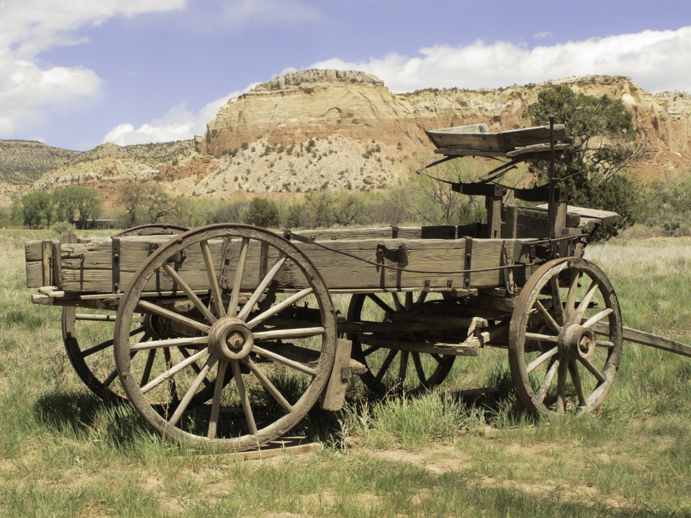 Basic transportation in the Old West wooden wagon on grassy valley floor in New Mexico.jpeg